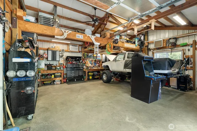 an aerial view of a house with swimming pool and big yard