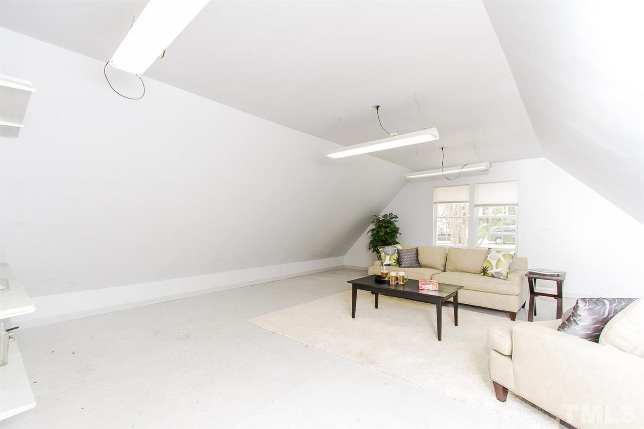 7617 Elliot Drive Raleigh, NC 27613 - Photo 20 of 25 a living room with furniture and wooden floor