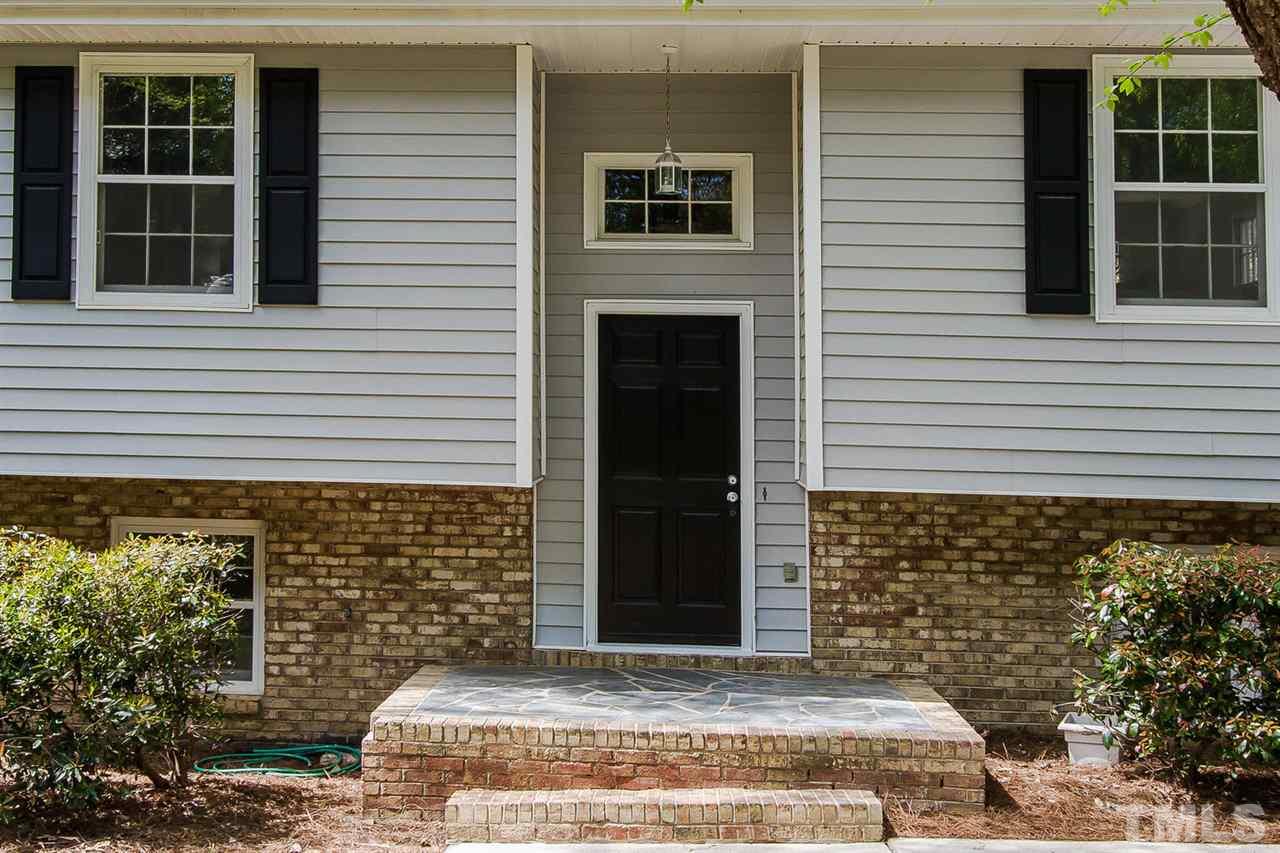 7617 Elliot Drive Raleigh, NC 27613 - Photo 3 of 25 a view of a entryway door front of a house