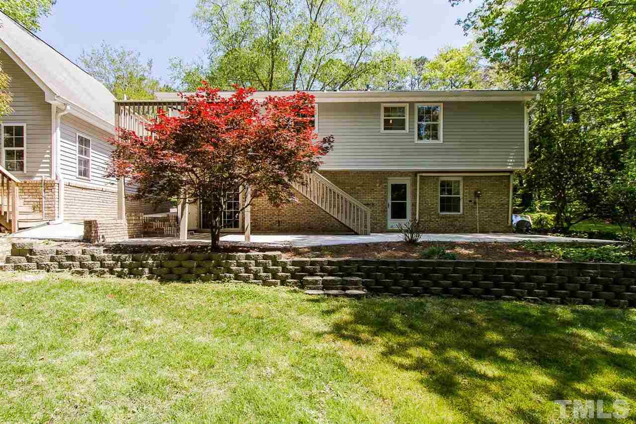 7617 Elliot Drive Raleigh, NC 27613 - Photo 22 of 25 a view of house with a garden
