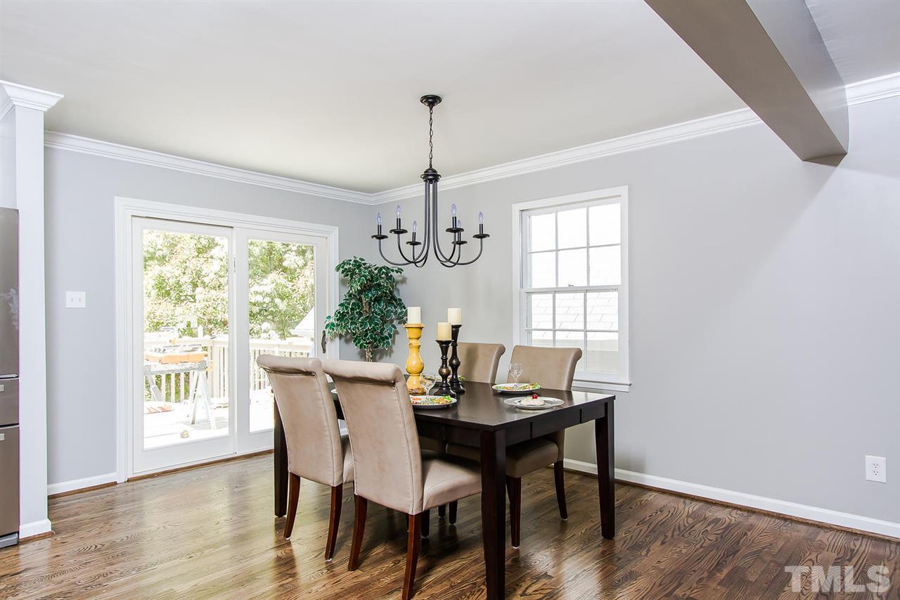 7617 Elliot Drive Raleigh, NC 27613 - Photo 6 of 25 a view of a dining room with furniture window and wooden floor