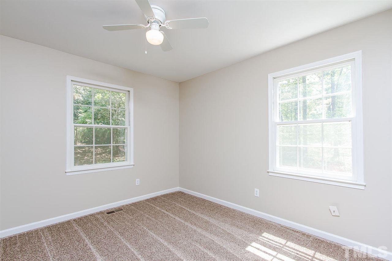 7617 Elliot Drive Raleigh, NC 27613 - Photo 10 of 25 a view of an empty room with a window
