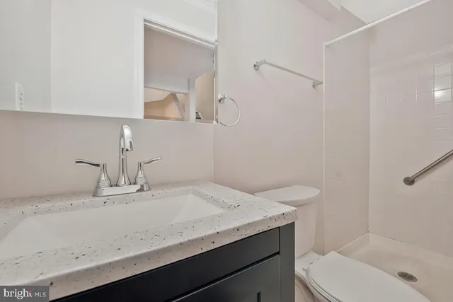 a view of a backyard with large trees