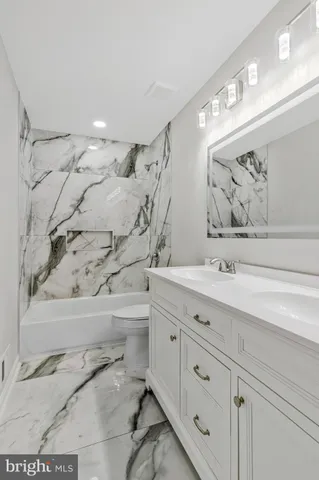 a view of hallway with wooden floor
