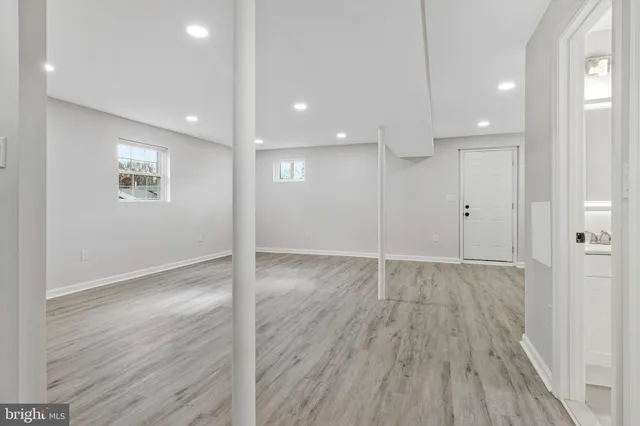 a view of entryway with wooden floor and stairs