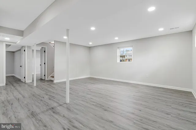 a view of a kitchen with wooden floor