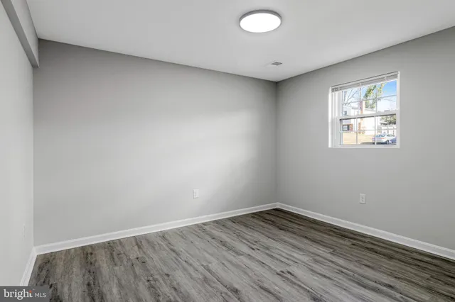 a view of pool with large tree