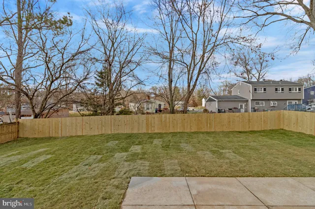 a view of a house with snow on the road