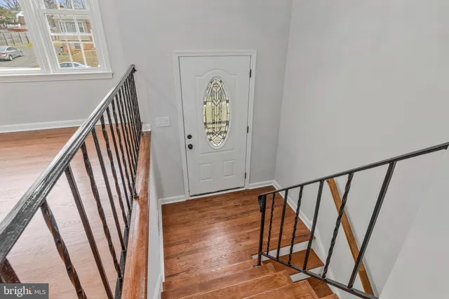 a view of a lobby with furniture and wooden floor