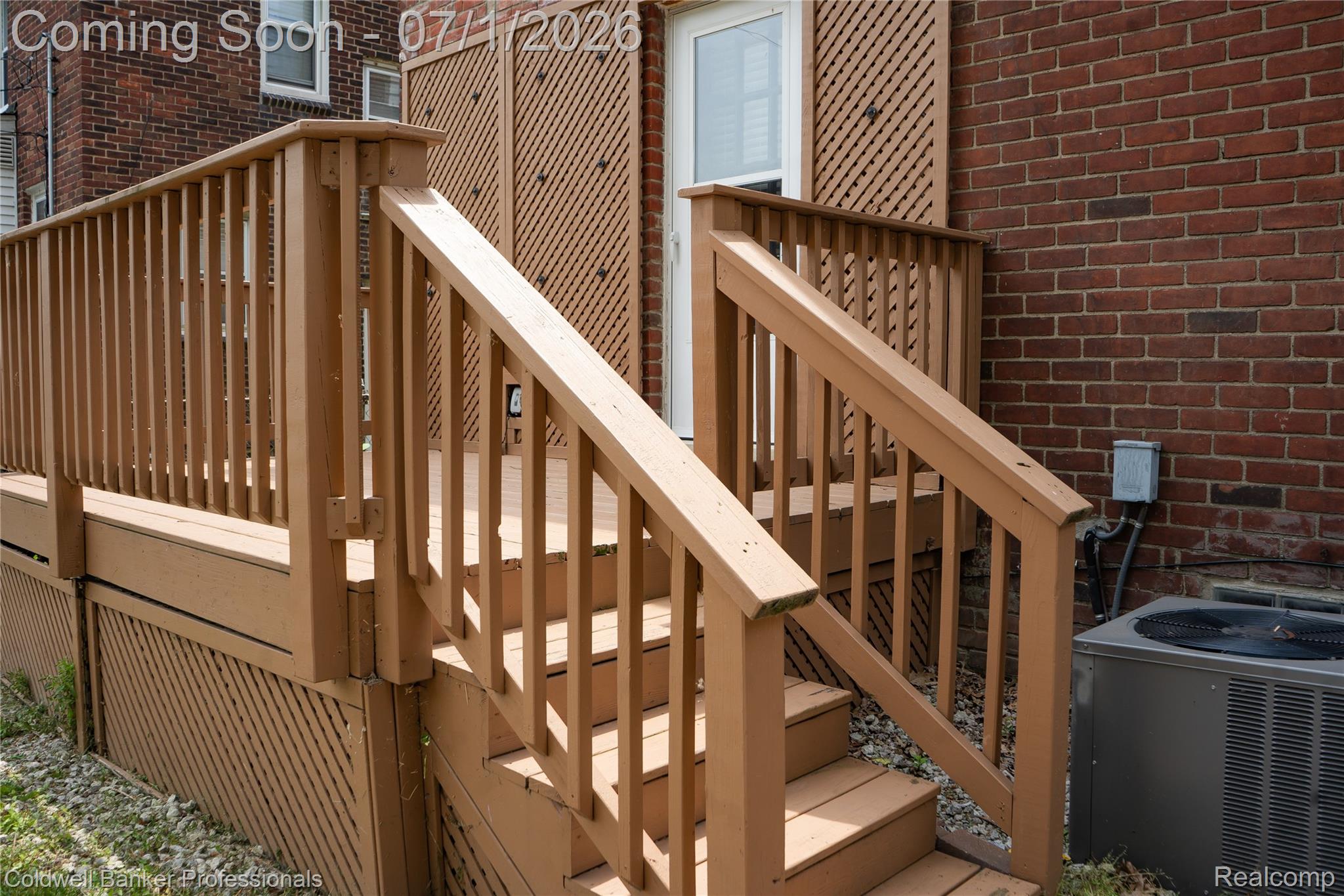 1168 Vernier Road Grosse Pointe, MI 48236 - Photo 6 of 32 Wood-tone deck featuring baluster railings and lattice skirting