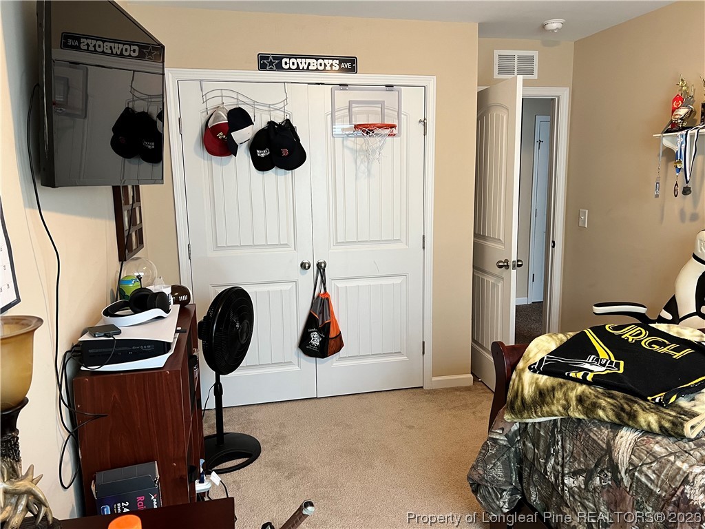 73 Blue Bay Lane Cameron, NC 28326 - Photo 29 of 42 a bedroom with a bed and cabinets