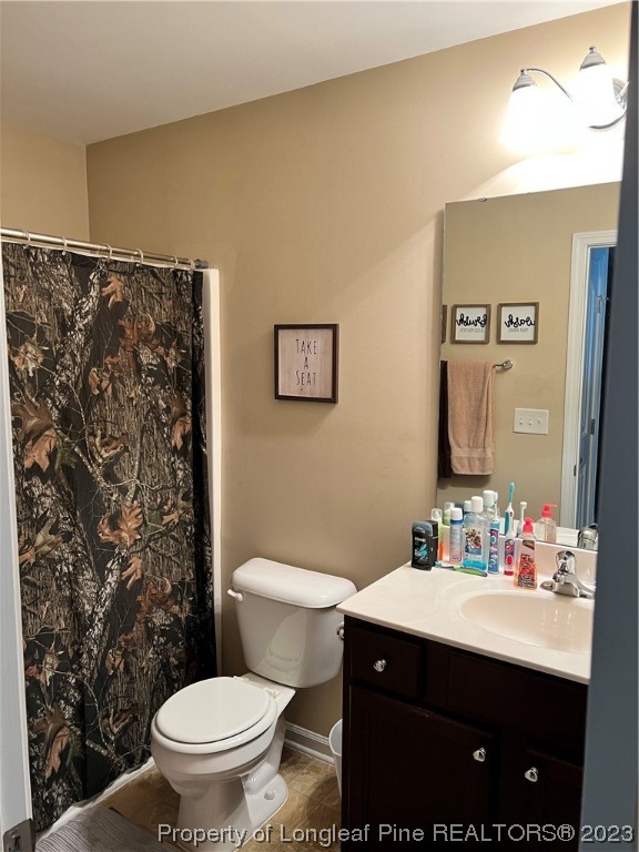 73 Blue Bay Lane Cameron, NC 28326 - Photo 31 of 42 a bathroom with a sink vanity mirror and toilet