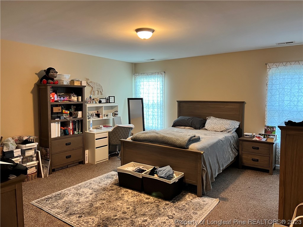 73 Blue Bay Lane Cameron, NC 28326 - Photo 35 of 42 a bedroom with a bed and furniture