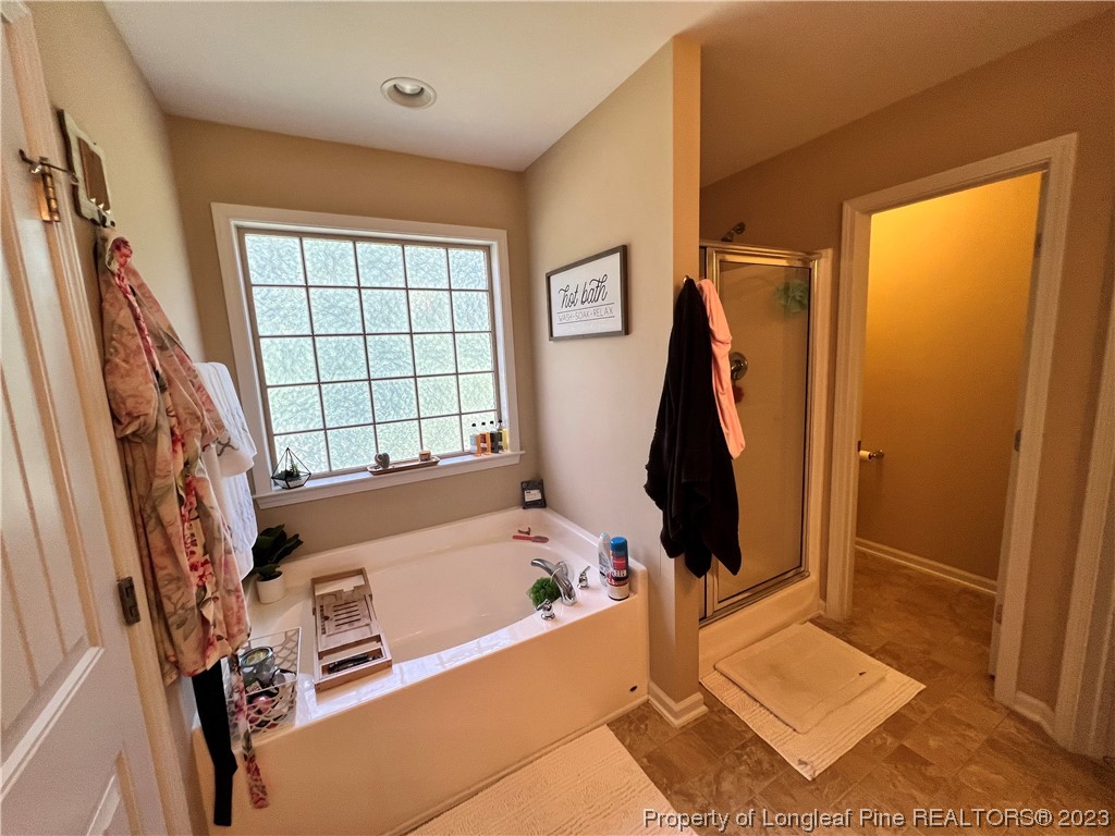 73 Blue Bay Lane Cameron, NC 28326 - Photo 39 of 42 a bath tub sitting next to a window