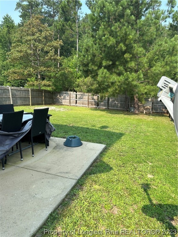 73 Blue Bay Lane Cameron, NC 28326 - Photo 41 of 42 a backyard of a house with table and chairs