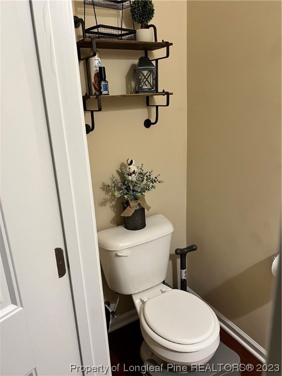 73 Blue Bay Lane Cameron, NC 28326 - Photo 5 of 42 a white toilet sitting next to a sink