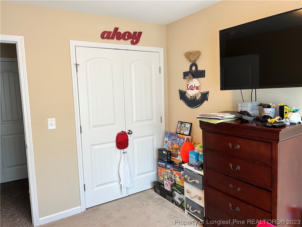 73 Blue Bay Lane Cameron, NC 28326 - Photo 10 of 42 a room with toys and flat screen tv