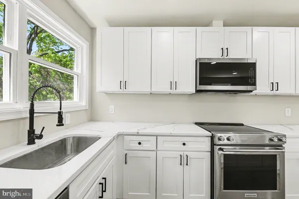a view of a kitchen with a sink