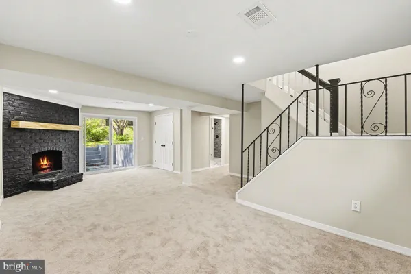 a bathroom with a granite countertop window a toilet and a shower