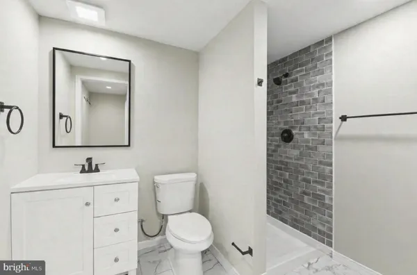 a view of room with window and wooden floor