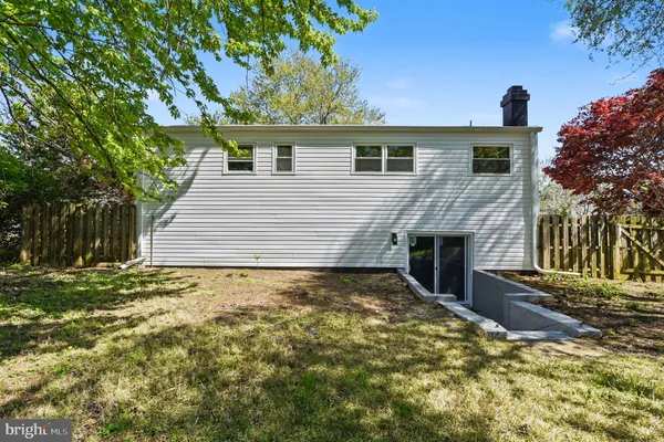 a view of an empty room and fire place