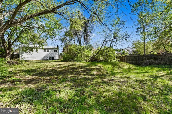 an empty room with wall painting and windows