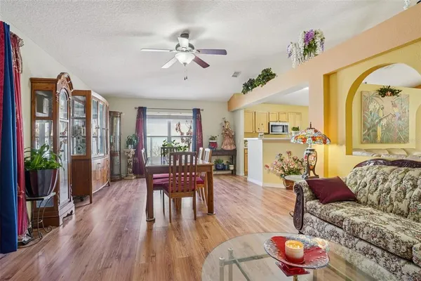 a view of a dining room with furniture and wooden floor