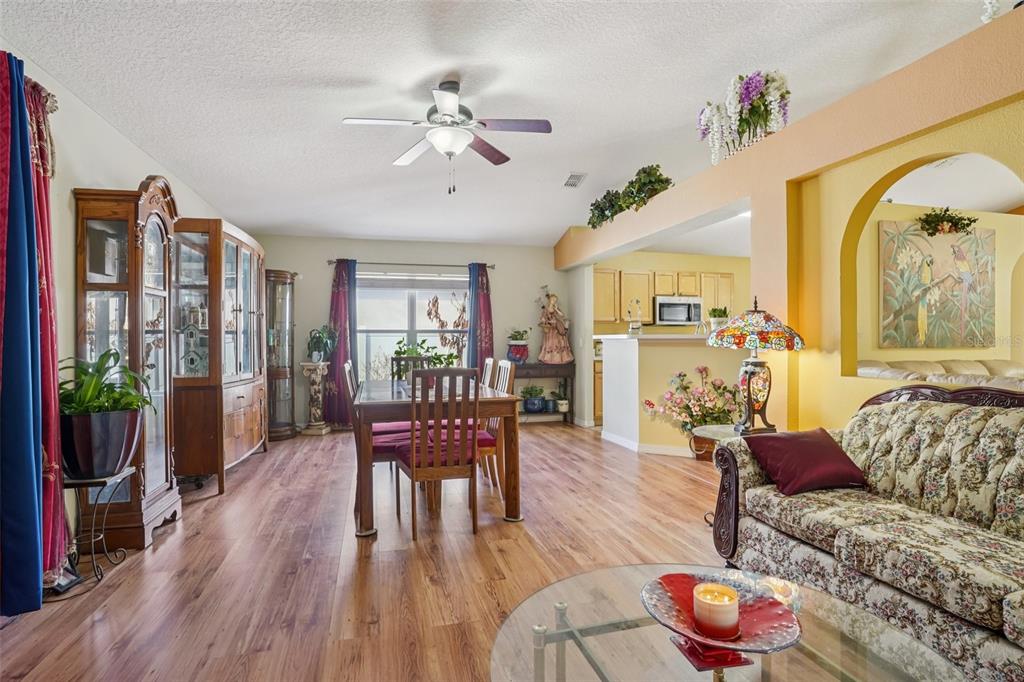 2315 Belfry Way Mascotte, FL 34753 - Photo 12 of 55 a living room with furniture and wooden floor