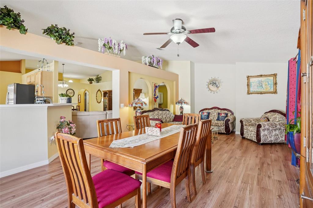 2315 Belfry Way Mascotte, FL 34753 - Photo 17 of 55 a view of a dining room with furniture and wooden floor