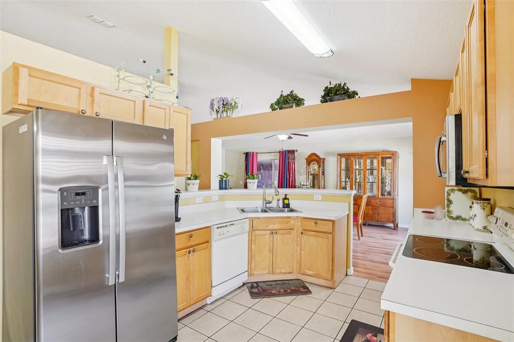 2315 Belfry Way Mascotte, FL 34753 - Photo 21 of 55 a kitchen with stainless steel appliances a sink and a refrigerator
