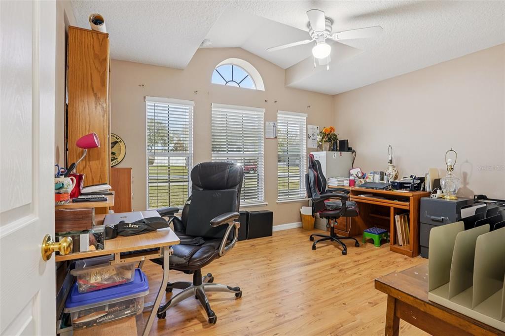 2315 Belfry Way Mascotte, FL 34753 - Photo 25 of 55 a view of a workspace with furniture and a window