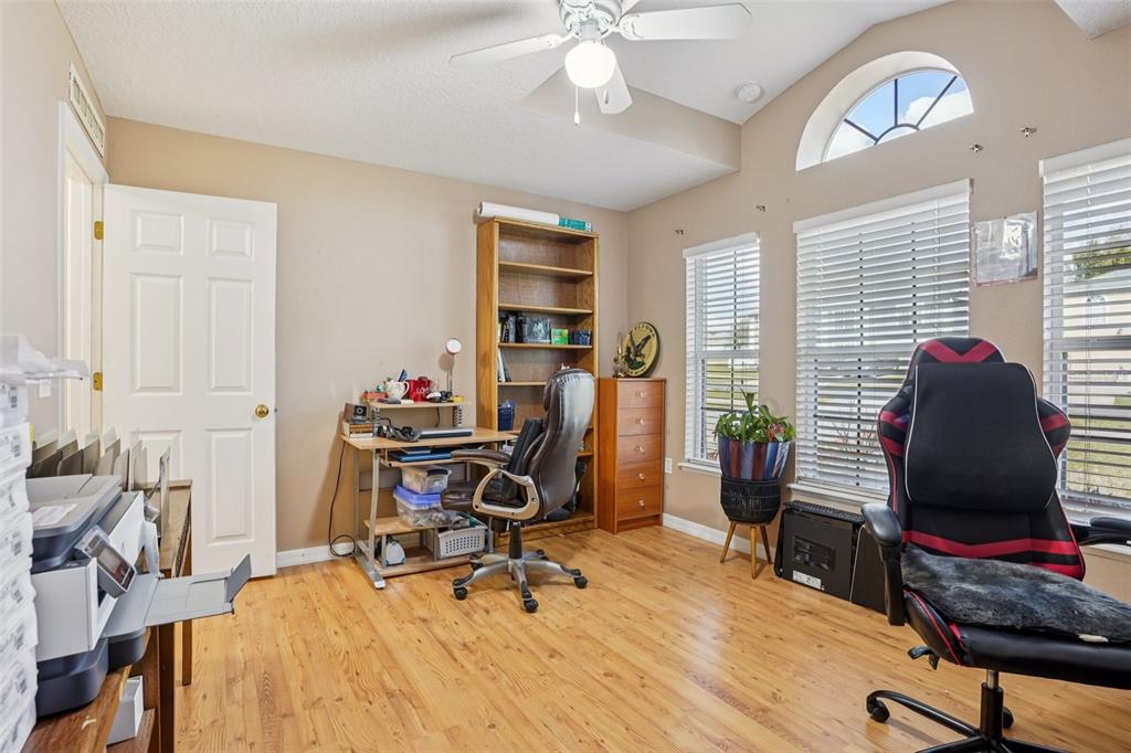 2315 Belfry Way Mascotte, FL 34753 - Photo 26 of 55 a view of a workspace with furniture and a window