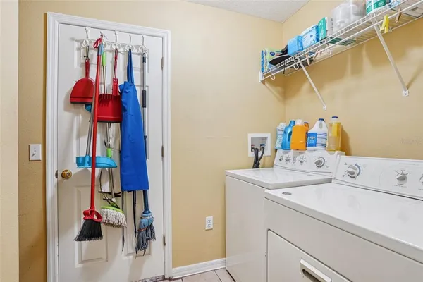 a bathroom with a double vanity sink mirror and toilet