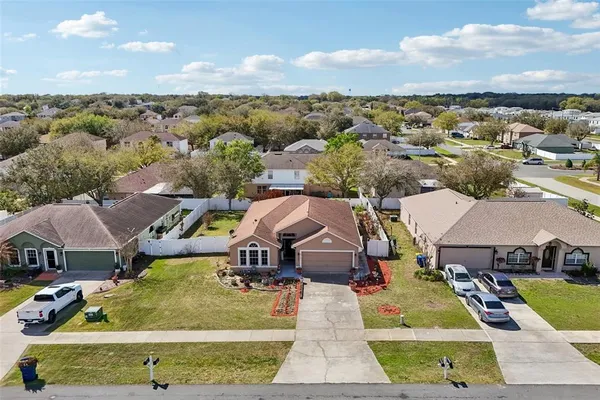 an aerial view of residential building and ocean