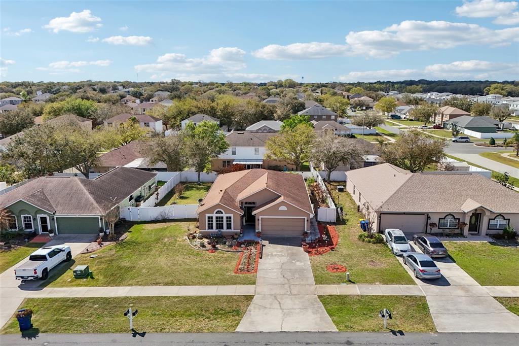 2315 Belfry Way Mascotte, FL 34753 - Photo 46 of 55 an aerial view of a house with a garden