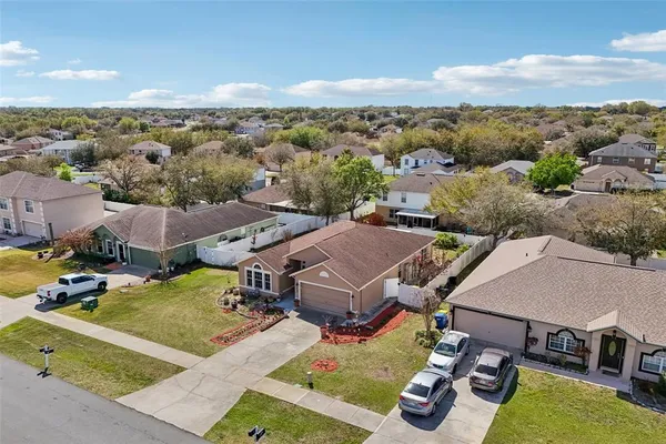 an aerial view of a house with a garden