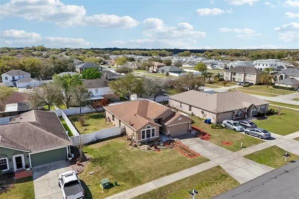 an aerial view of residential houses with outdoor space