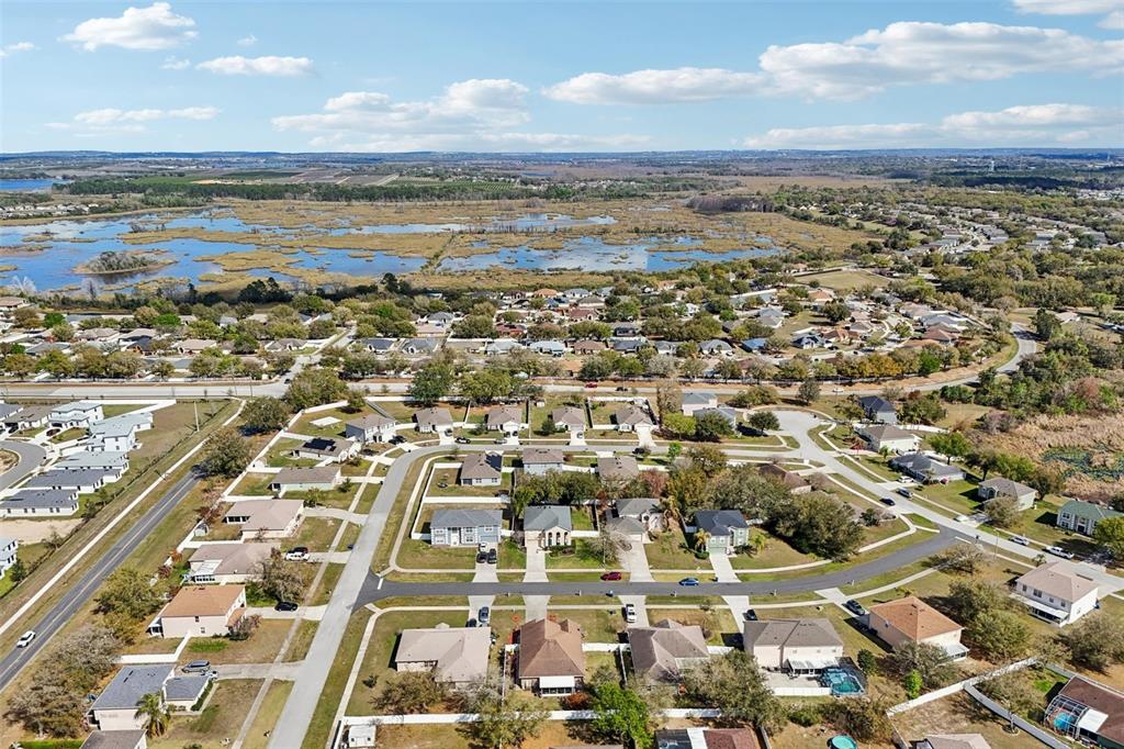 2315 Belfry Way Mascotte, FL 34753 - Photo 51 of 55 an aerial view of residential building and ocean