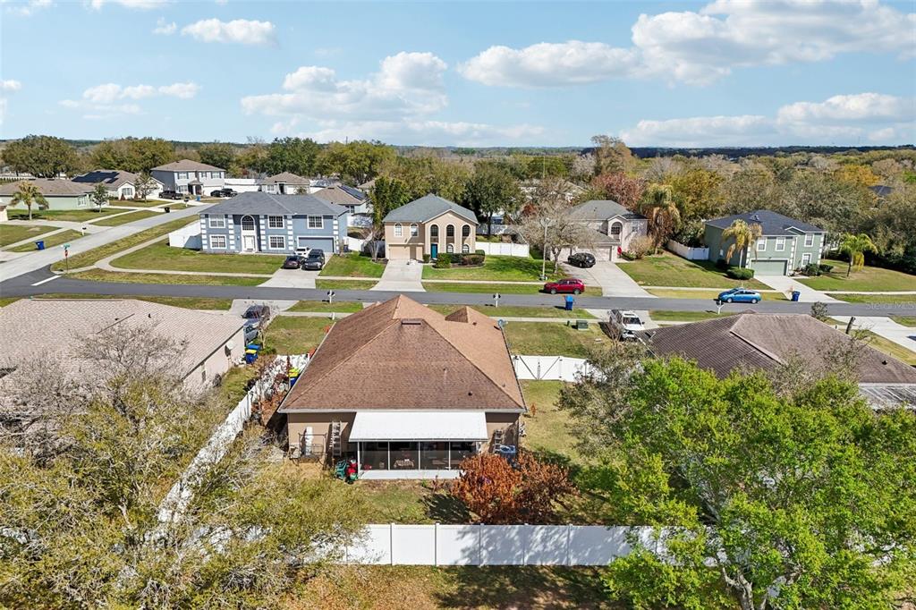 2315 Belfry Way Mascotte, FL 34753 - Photo 52 of 55 an aerial view of a house with a garden