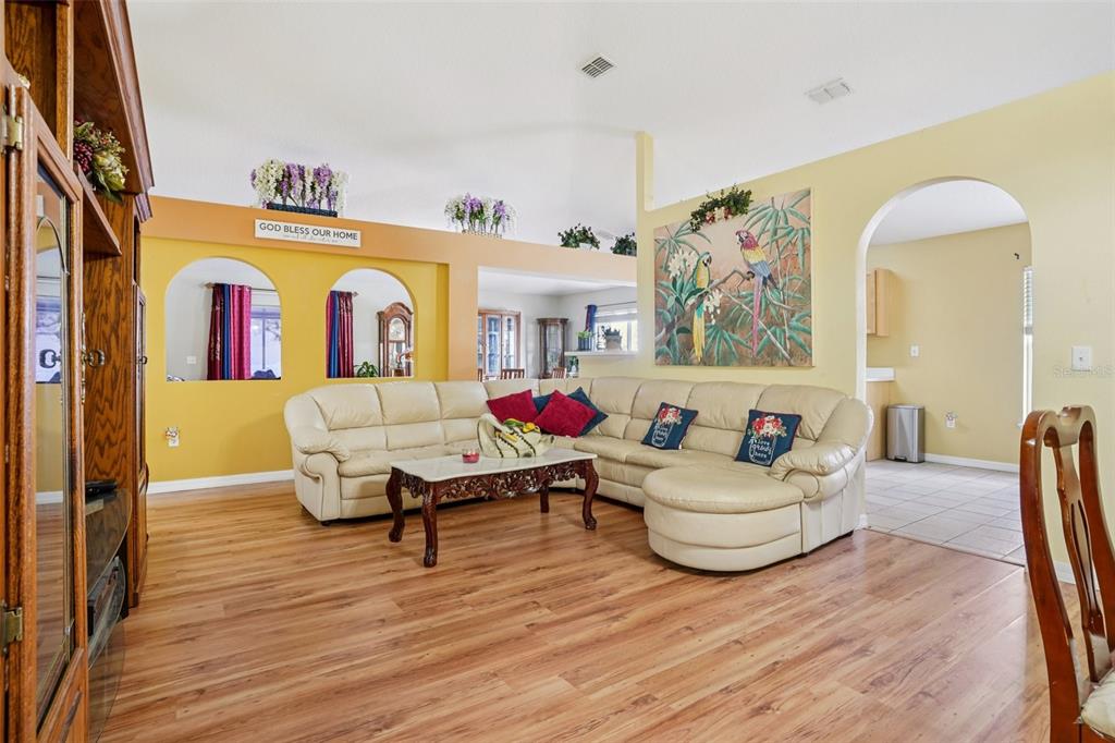 2315 Belfry Way Mascotte, FL 34753 - Photo 6 of 55 a living room with furniture window and wooden floor