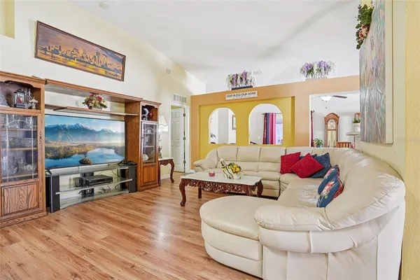 a living room with furniture and a flat screen tv