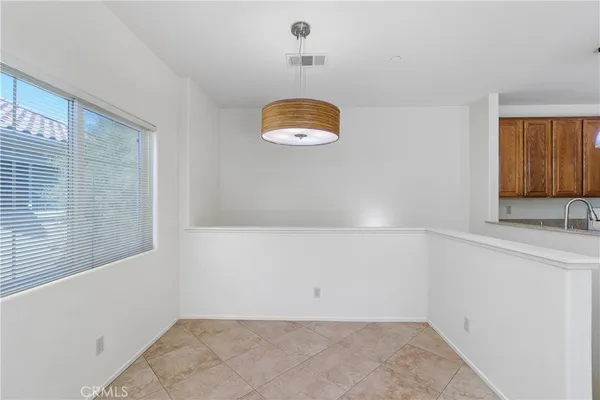 a view of a room with window and cabinet