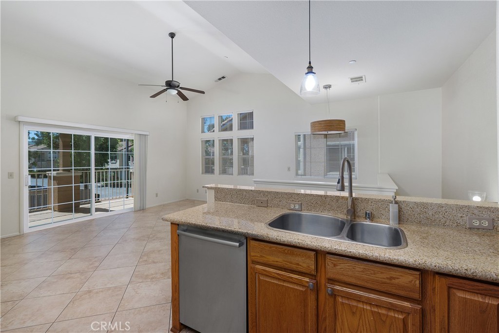 93 Kansas Street, Unit 202 Redlands, CA 92373 - Photo 19 of 40 a kitchen with a sink a counter space cabinets and appliances