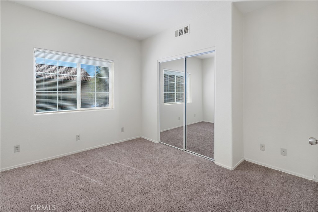 93 Kansas Street, Unit 202 Redlands, CA 92373 - Photo 20 of 40 an empty room with windows