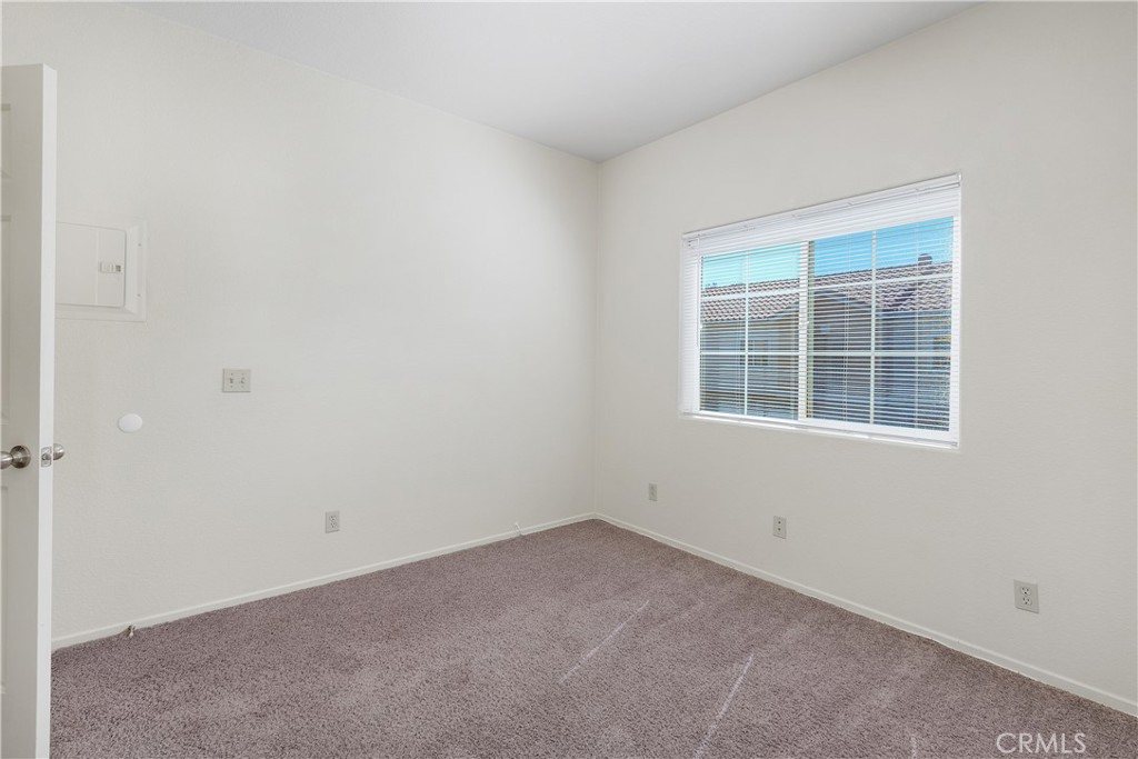 93 Kansas Street, Unit 202 Redlands, CA 92373 - Photo 21 of 40 an empty room with a window