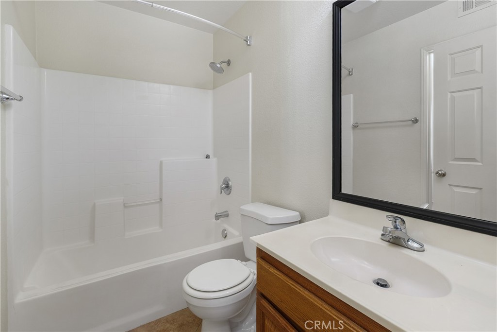 93 Kansas Street, Unit 202 Redlands, CA 92373 - Photo 23 of 40 a bathroom with a sink toilet and shower