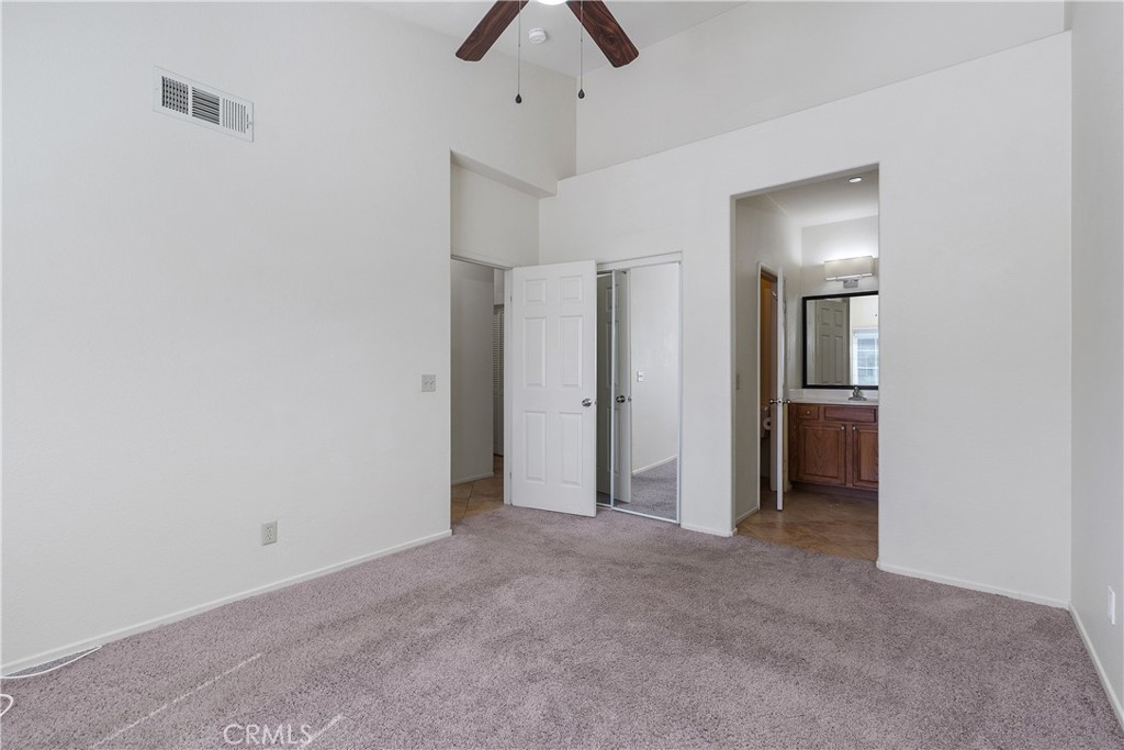 93 Kansas Street, Unit 202 Redlands, CA 92373 - Photo 26 of 40 an empty room with chandelier fan