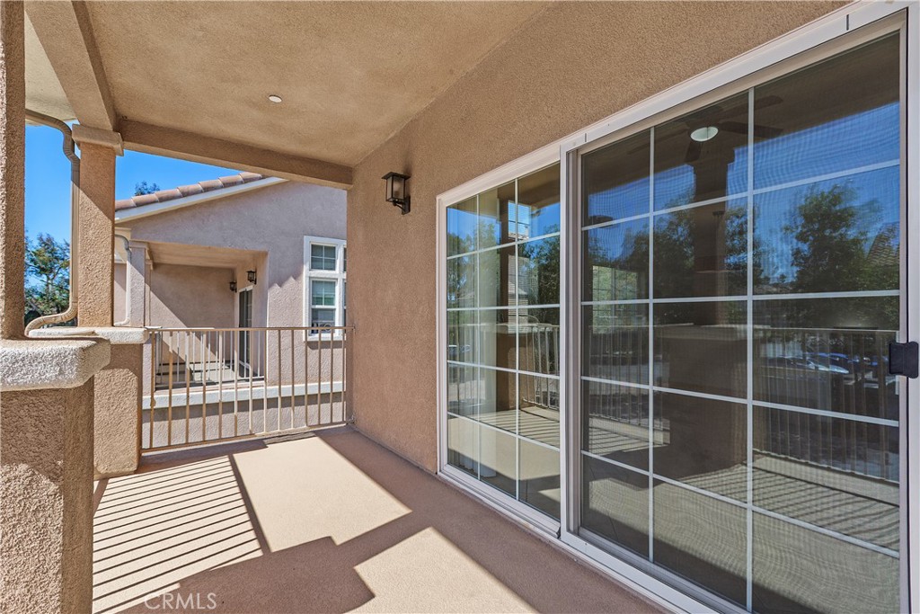 93 Kansas Street, Unit 202 Redlands, CA 92373 - Photo 32 of 40 a view of balcony with a floor to ceiling window and wooden floor