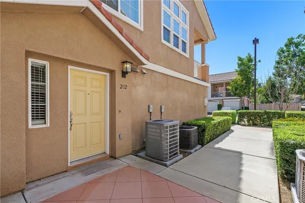 an outdoor view of a house with entryway