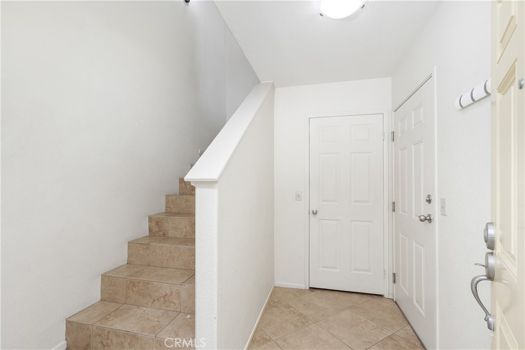 93 Kansas Street, Unit 202 Redlands, CA 92373 - Photo 6 of 40 a view of a hallway with white walls and white walls